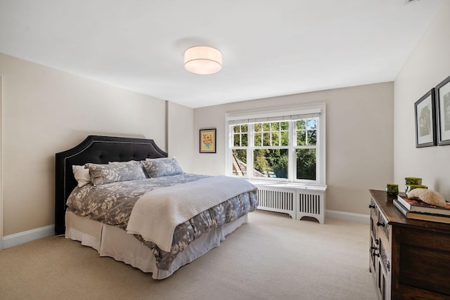 carpeted bedroom with radiator heating unit