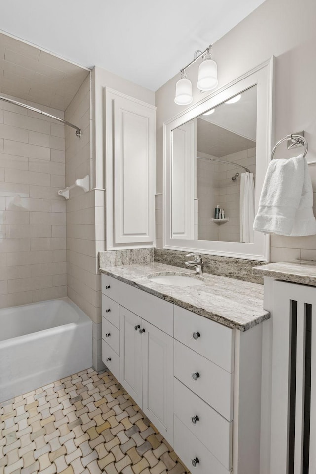 bathroom with vanity and shower / tub combo