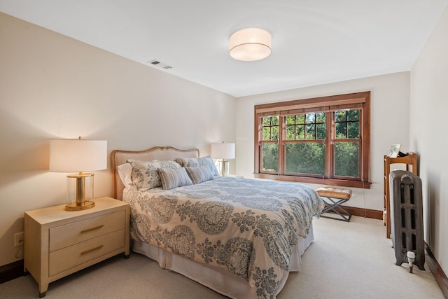 carpeted bedroom featuring radiator heating unit