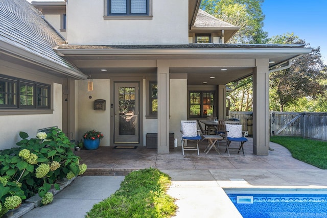 entrance to property featuring a patio area