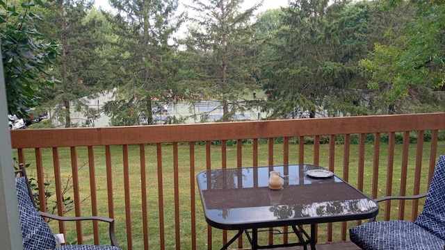 wooden terrace with a lawn