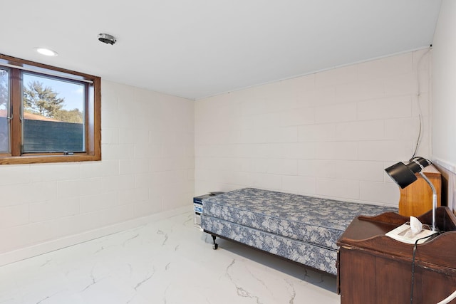 bedroom featuring recessed lighting and marble finish floor