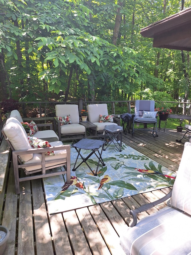 wooden deck with an outdoor hangout area