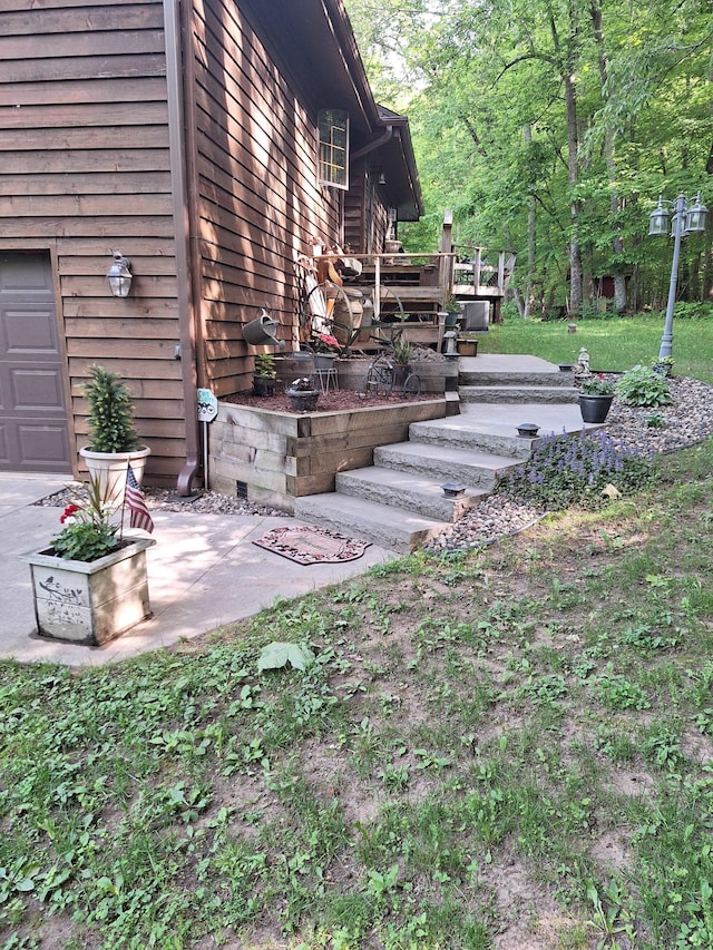 exterior space with stairway and a patio area