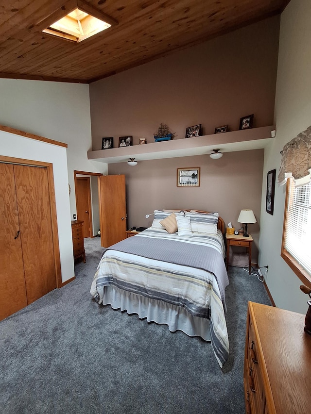 bedroom with high vaulted ceiling, wooden ceiling, and dark carpet