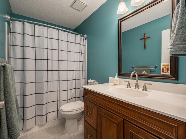 bathroom featuring a shower with shower curtain, vanity, a textured ceiling, tile patterned floors, and toilet