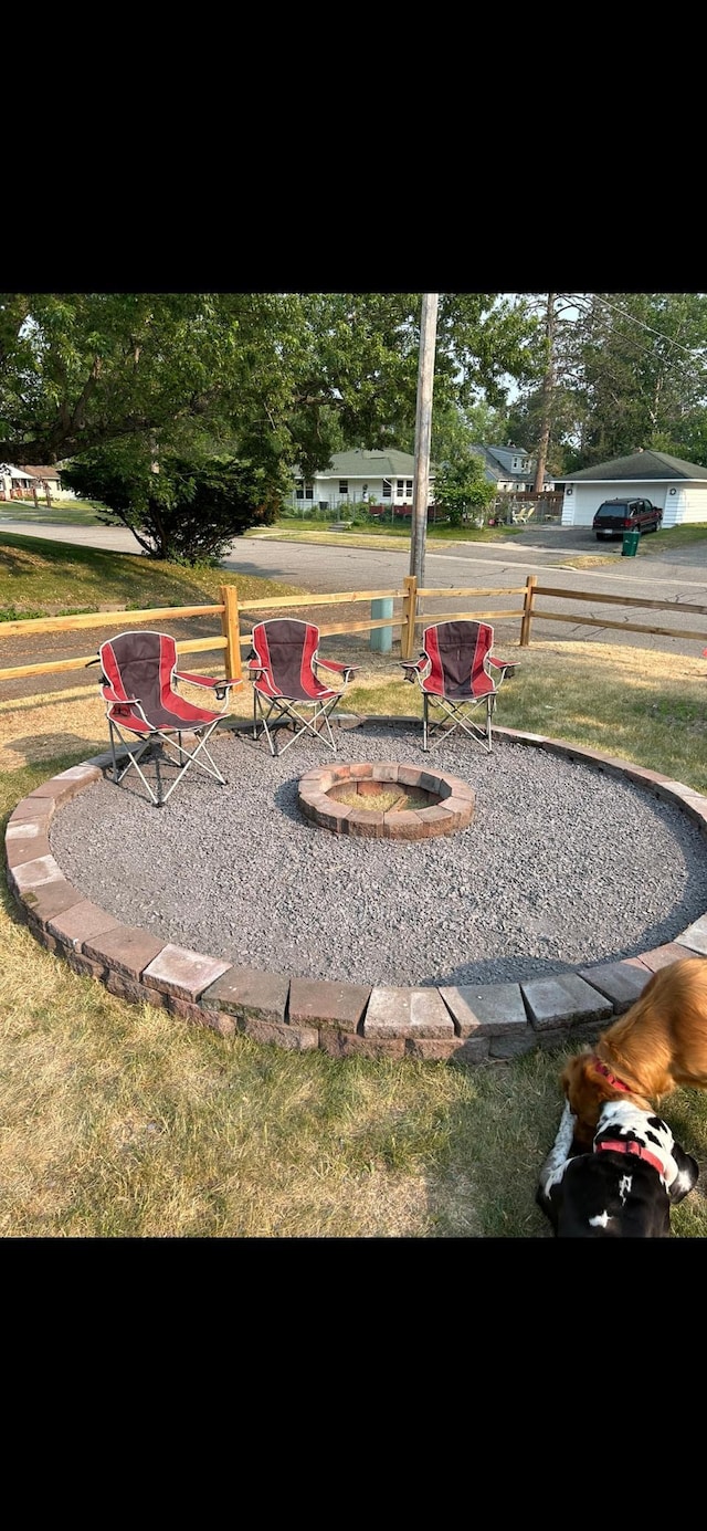 view of yard with a fire pit