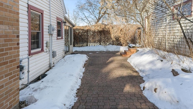 view of yard layered in snow