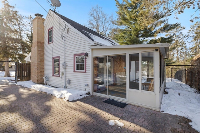 back of house featuring a patio and a sunroom