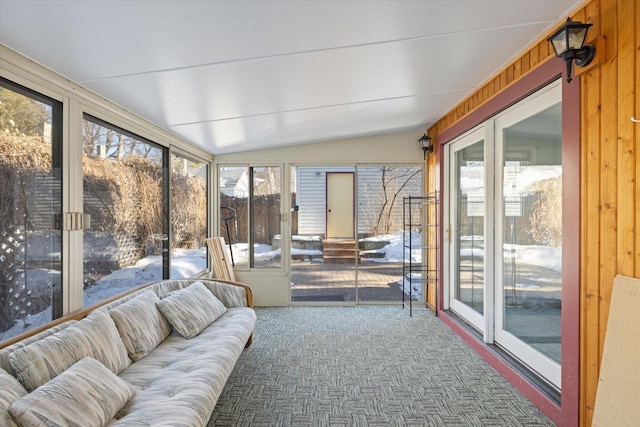 sunroom featuring lofted ceiling and a wealth of natural light