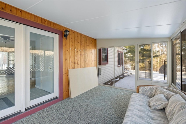 sunroom / solarium featuring lofted ceiling