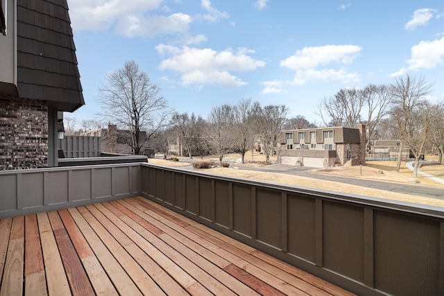 wooden terrace with a residential view