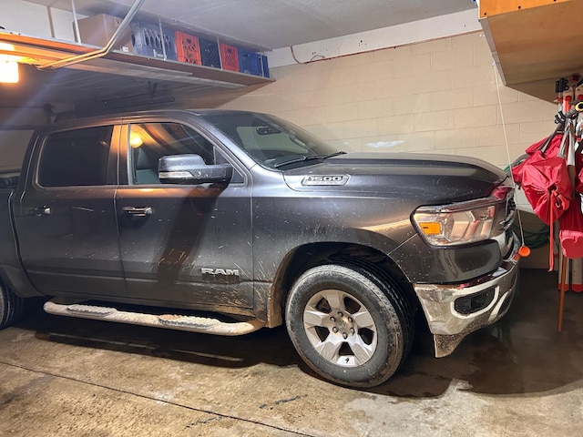 garage with concrete block wall