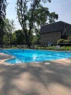 community pool with a patio