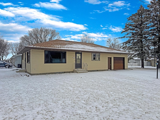 single story home featuring a garage