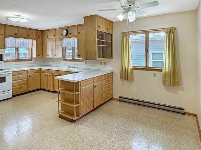 kitchen with sink, a baseboard heating unit, ceiling fan, kitchen peninsula, and electric stove