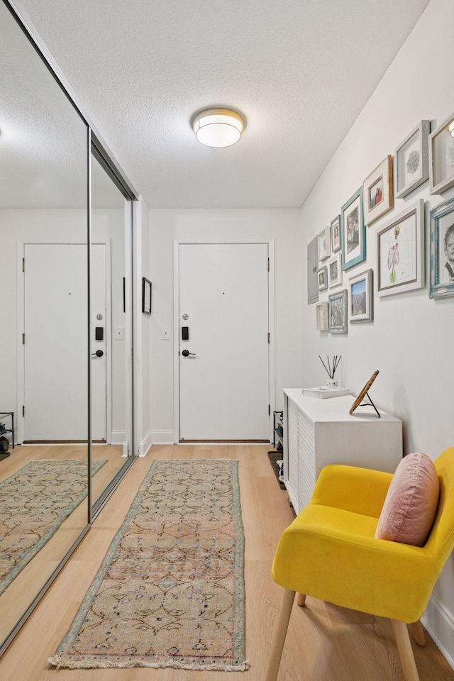 4360 Brookside Ct Unit 201, Edina, MN 55436 - foyer entrance featuring a textured ceiling and light wood-type flooring