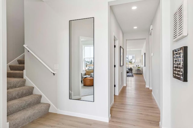10974 37th St N, Lake Elmo, MN 55042 - corridor with recessed lighting, baseboards, stairway, and light wood finished floors