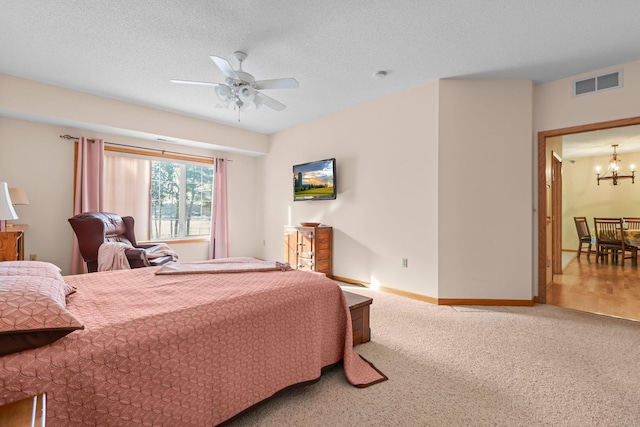 11030 Mississippi Blvd NW Unit 221, Coon Rapids, MN 55433 - bedroom with a chandelier, carpet, a ceiling fan, and baseboards