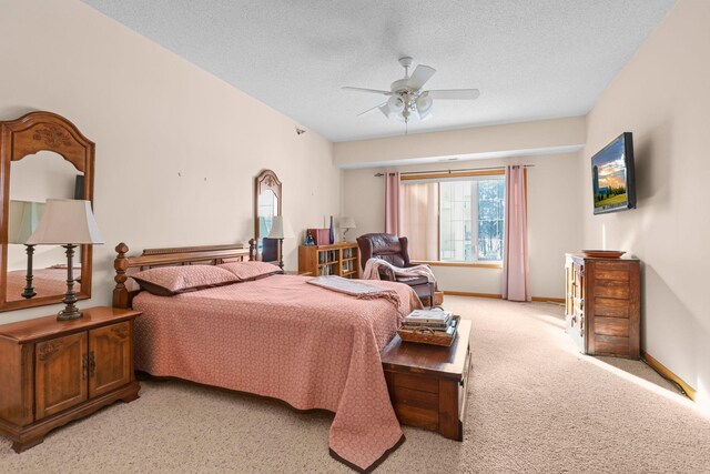 11030 Mississippi Blvd NW Unit 221, Coon Rapids, MN 55433 - bedroom featuring light carpet, a textured ceiling, baseboards, and a ceiling fan