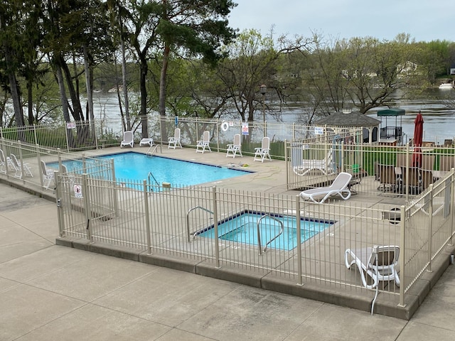 11030 Mississippi Blvd NW Unit 221, Coon Rapids, MN 55433 - community pool with fence and a patio area