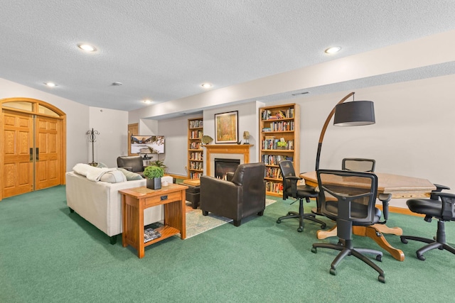 11030 Mississippi Blvd NW Unit 221, Coon Rapids, MN 55433 - carpeted living area featuring a textured ceiling, a warm lit fireplace, recessed lighting, and an office area