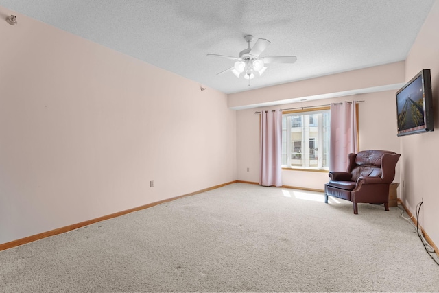 11030 Mississippi Blvd NW Unit 221, Coon Rapids, MN 55433 - unfurnished room featuring light carpet, ceiling fan, baseboards, and a textured ceiling