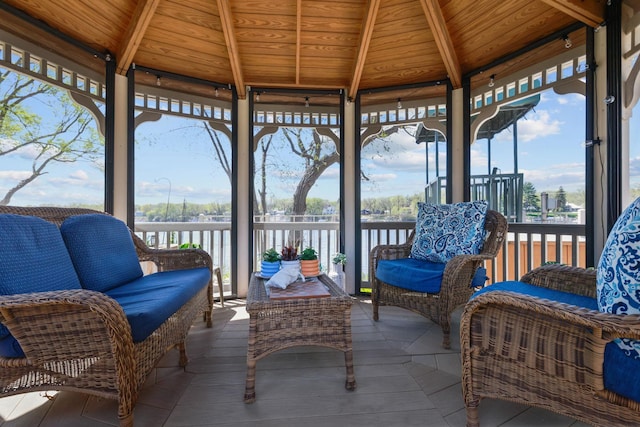 11030 Mississippi Blvd NW Unit 221, Coon Rapids, MN 55433 - sunroom / solarium with beamed ceiling, a water view, and an outdoor living space
