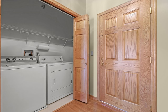 11030 Mississippi Blvd NW Unit 221, Coon Rapids, MN 55433 - laundry area with washer and dryer and light wood finished floors