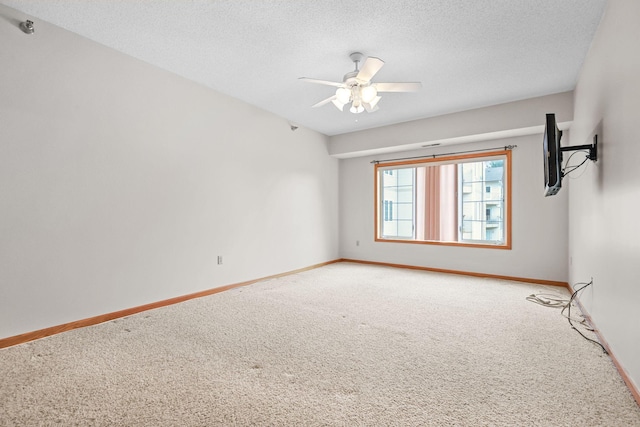 11030 Mississippi Blvd NW Unit 221, Coon Rapids, MN 55433 - unfurnished room with light colored carpet, baseboards, a textured ceiling, and a ceiling fan