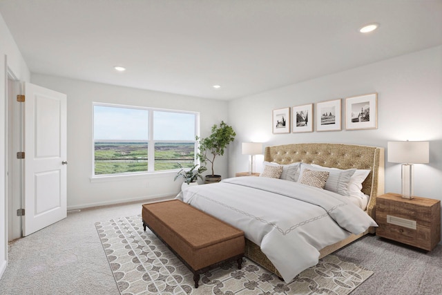 bedroom featuring light carpet