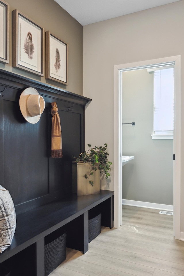 mudroom with light wood-type flooring