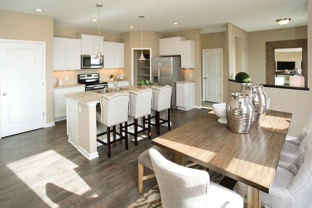 dining room with dark hardwood / wood-style flooring