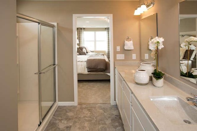 bathroom with vanity and a shower with shower door