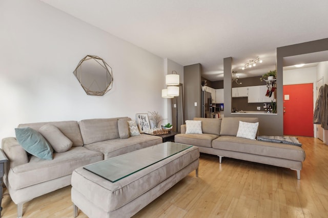 living room with light hardwood / wood-style flooring