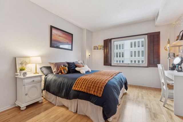 bedroom with light hardwood / wood-style flooring