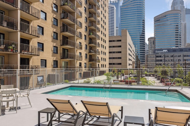 view of swimming pool with a patio