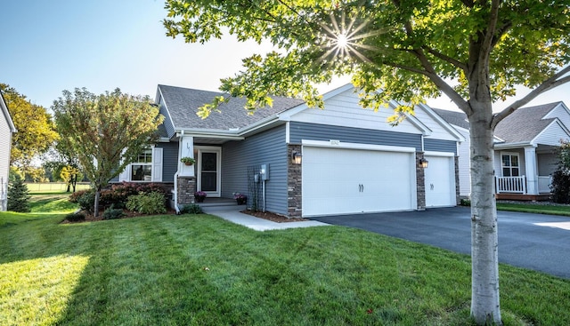 view of front of house featuring a garage and a front yard