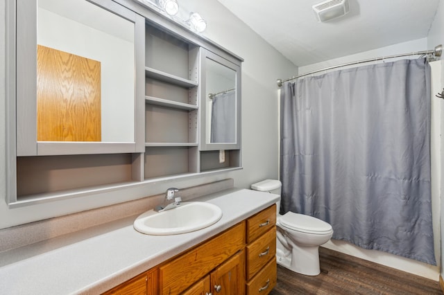 bathroom featuring hardwood / wood-style flooring, vanity, and toilet