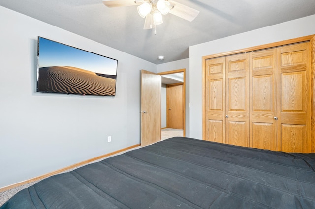 unfurnished bedroom with ceiling fan, carpet floors, and a closet