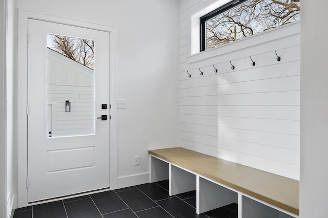 mudroom featuring dark tile patterned floors