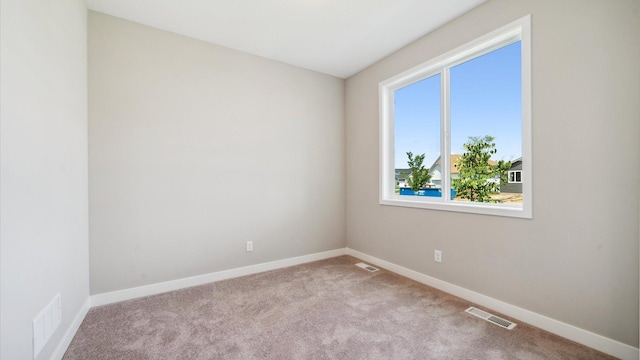7472 170th Ave NW, Ramsey, MN 55303 - carpeted empty room with baseboards and visible vents