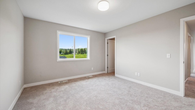 7472 170th Ave NW, Ramsey, MN 55303 - unfurnished room featuring carpet floors, baseboards, and visible vents