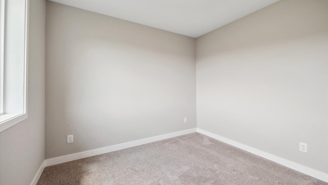 7472 170th Ave NW, Ramsey, MN 55303 - carpeted empty room featuring baseboards