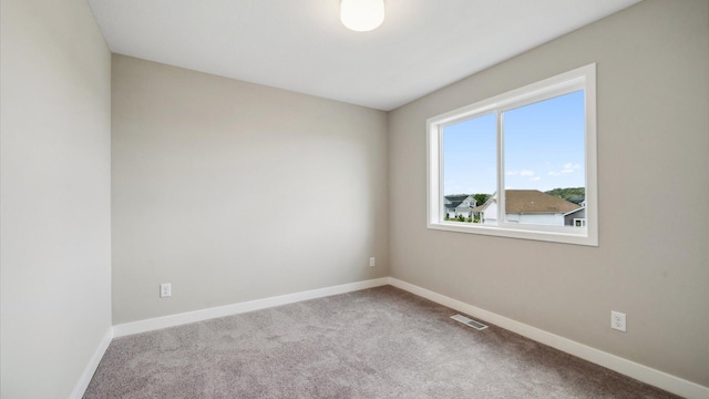 7472 170th Ave NW, Ramsey, MN 55303 - unfurnished room featuring carpet, baseboards, and visible vents