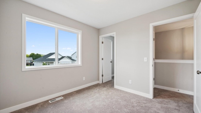 7472 170th Ave NW, Ramsey, MN 55303 - unfurnished bedroom with baseboards, carpet floors, and visible vents