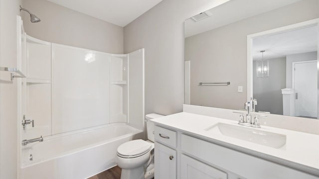7472 170th Ave NW, Ramsey, MN 55303 - bathroom featuring bathtub / shower combination, toilet, vanity, wood finished floors, and visible vents