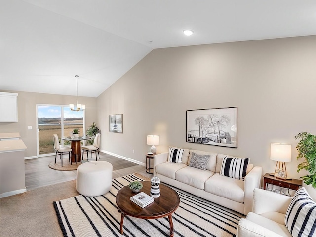 living room with an inviting chandelier and high vaulted ceiling