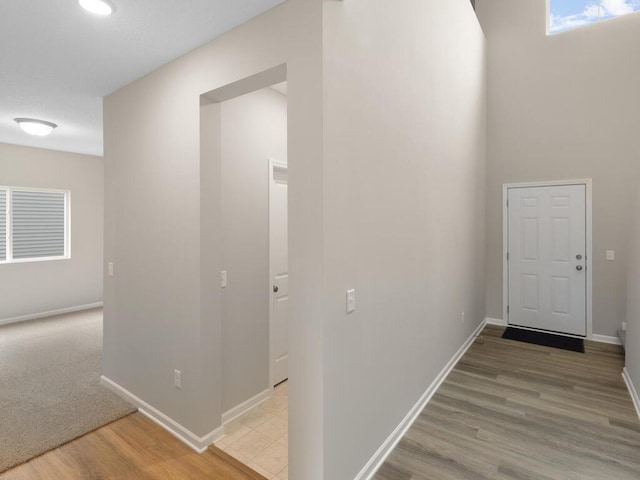 corridor featuring hardwood / wood-style flooring