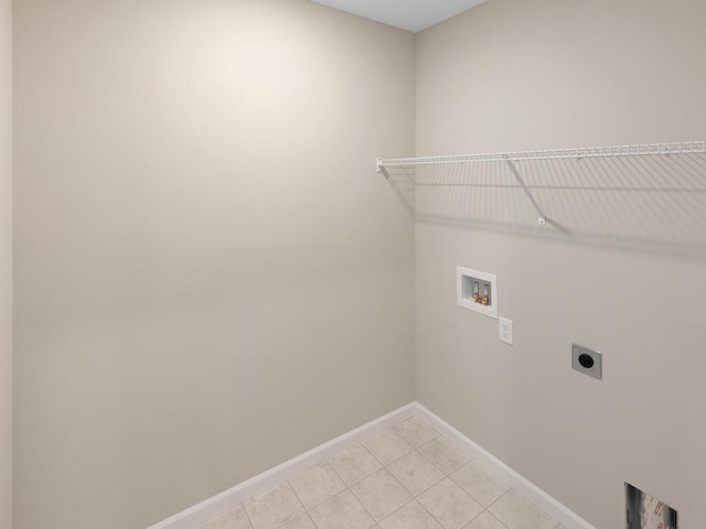 laundry room featuring washer hookup, hookup for an electric dryer, and light tile patterned flooring